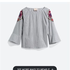 Blue striped blouse with floral stitch